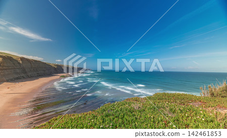 Panorama showing Magoito Beach on Atlantic ocean aerial timelapse, beautiful sandy beach on Sintra coast, Lisbon district, Portugal Panorama showing Magoito Beach on Atlantic ocean aerial timelapse, beautiful sandy beach on Sintra coast, Lisbon district, Portugal 142461853