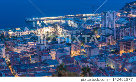 Cityscape of Monte Carlo, Monaco day to night timelapse with roofs of buildings after summer sunset. Cityscape of Monte Carlo, Monaco day to night timelapse with roofs of buildings after summer sunset. 142461877