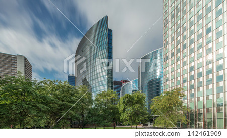 Timelapse panorama of modern office buildings. Glass skyscrapers with reflections and highlights Timelapse panorama of modern office buildings. Glass skyscrapers with reflections and highlights 142461909