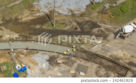 Concrete works for road construction with many workers and mixer timelapse Concrete works for road construction with many workers and mixer timelapse 142461929