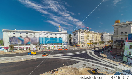 Workers operating asphalt paver machines during road construction and repairing works timelapse Workers operating asphalt paver machines during road construction and repairing works timelapse 142461937