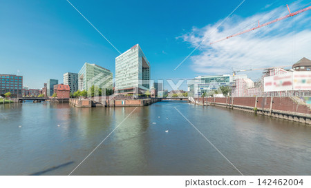 Panorama showing Hamburg HafenCity skyline timelapse at Ericusgraben with a view of modern Spiegel office buildings Panorama showing Hamburg HafenCity skyline timelapse at Ericusgraben with a view of modern Spiegel office buildings 142462004