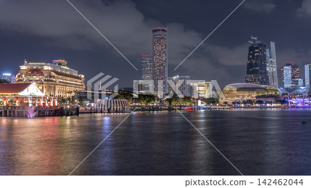 City skyline with skyscrapers and Esplanade Theatres on the Bay in Singapore at dusk, with beautiful reflection in water day to night timelapse City skyline with skyscrapers and Esplanade Theatres on the Bay in Singapore at dusk, with beautiful reflection in water day to night timelapse 142462044