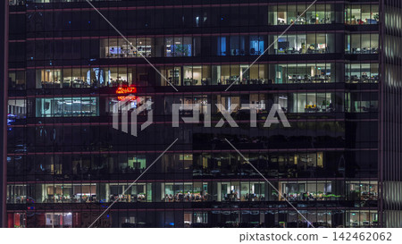 Modern office building with big windows at night timelapse, in windows light shines Modern office building with big windows at night timelapse, in windows light shines 142462062