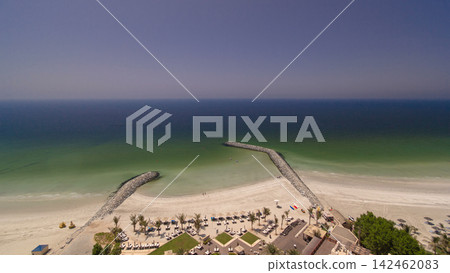 Beautiful area of beach in Ajman timelapse near the turquoise waters of Arabian Gulf. Beautiful area of beach in Ajman timelapse near the turquoise waters of Arabian Gulf. 142462083