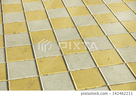 Pavement. Sidewalk tile background. Pavement tile. Top view. Closeup. Footpath. Bright tone two colors Pavement. Sidewalk tile background. Pavement tile. Top view. Closeup. Footpath. Bright tone two colors 142462211