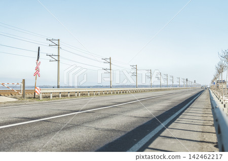 Autumn sunny beautiful day on outside city highway. Shallow depth of the field. Rail along road. Autumn sunny beautiful day on outside city highway. Shallow depth of the field. Rail along road. 142462217