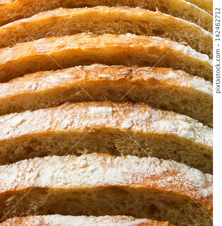 close up crusty wheat rustic bread with sourdough , food textured. close up artisan bread or traditional wheat rustic bread textured. wheat bread close up. close up crusty wheat rustic bread with sourdough , food textured. close up artisan bread or traditional wheat rustic bread textured. wheat bread close up. 142462712