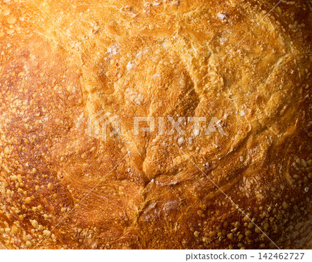 close up of wheat rustic bread with sourdough , food textured. Background of wheat bread with sourdough. wheat rustic bread with sourdough close up. close up of wheat rustic bread with sourdough , food textured. Background of wheat bread with sourdough. wheat rustic bread with sourdough close up. 142462727