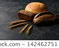 bread on dark table. bread on dark table. different types bread on dark kitchen table, copy space for text. 142462751