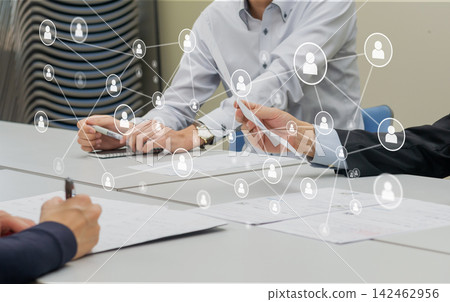 A graphic illustrating business professionals sharing documents in a meeting and their networking skills, representing the relationship between personal connections and digital transformation (DX). A graphic illustrating business professionals sharing documents in a meeting and their networking skills, representing the relationship between personal connections and digital transformation (DX). 142462956