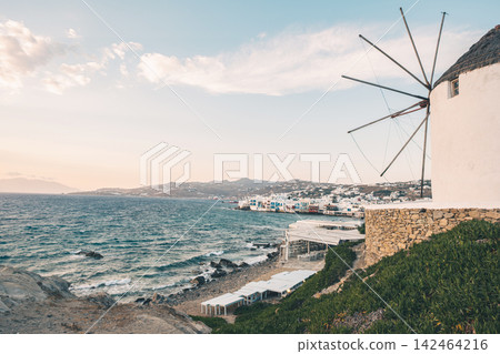 Scenic Sea With A Windmill In Front And A Greek Island Landscape 142464216