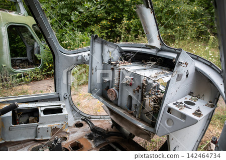 Decayed helicopter cockpit with exposed wiring Decayed helicopter cockpit with exposed wiring 142464734