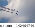 Three airplane jets in airshow formation in clouds 142464749