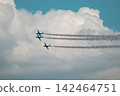 Jet planes trio performs aerobatics in cloudy sky 142464751