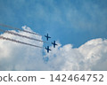 Jet airplanes perform aerobatics in cloudy sky 142464752
