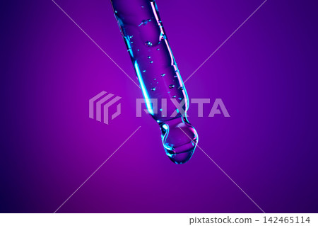 Serum drop dripping from pipette creating bubbles in liquid Serum drop dripping from pipette creating bubbles in liquid 142465114