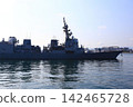 The destroyer Akizuki is in port. 142465728
