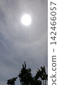 Contrail heading towards the sun 142466057