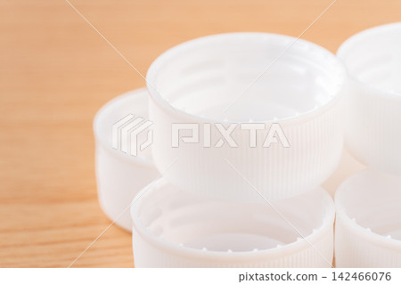Close-up of a white plastic bottle cap (lid) Close-up of a white plastic bottle cap (lid) 142466076