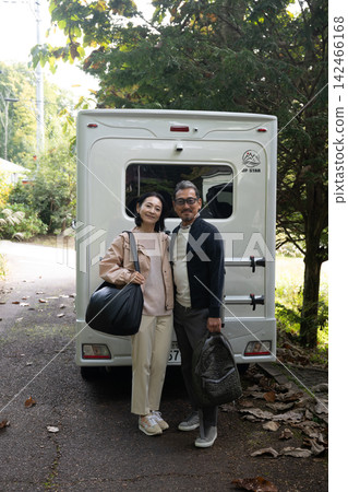 A smiling couple in front of a camper van in Kiyosato Highlands A smiling couple in front of a camper van in Kiyosato Highlands 142466168