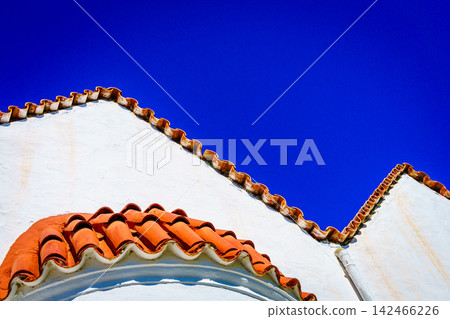 Greek church roof tiles against blue sky Crete Greece Greek church roof tiles against blue sky Crete Greece 142466226