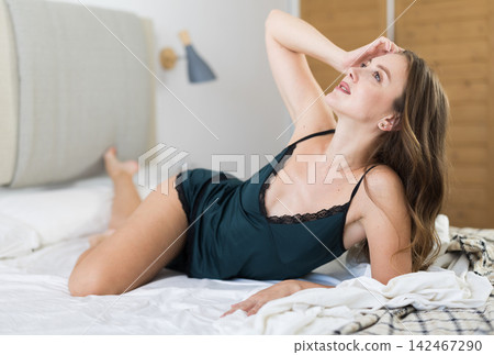 Woman posing in bedroom in home clothes 142467290