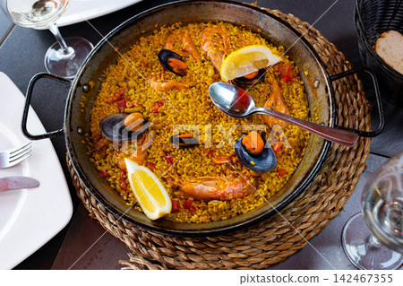 Just cooked paella de marisco on table 142467355