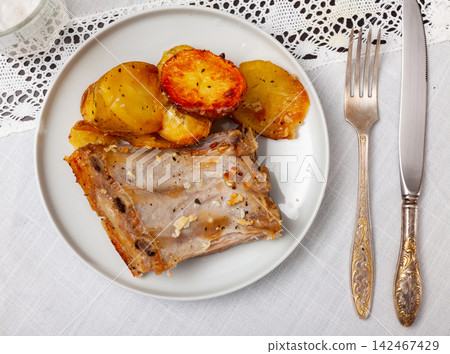 Roasted pork ribs with fried potatoes Roasted pork ribs with fried potatoes 142467429