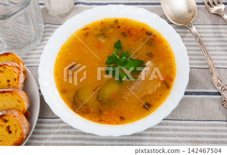 Popular dish of Russian cuisine is Pickle soup Popular dish of Russian cuisine is Pickle soup 142467504