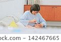 Image of a mother brushing her teeth 142467665