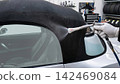 Car maintenance: Cleaning the soft top of a convertible. 142469084