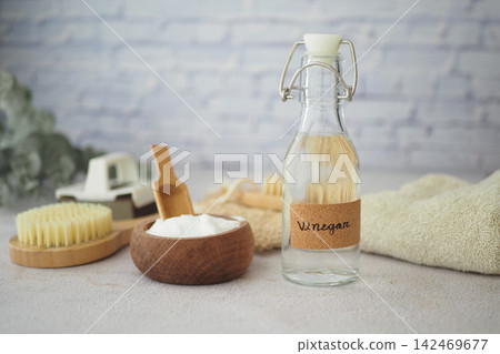 Vinegar and bowl on kitchen counter Vinegar and bowl on kitchen counter 142469677