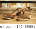 Worn sandals on the floor at home 142469691