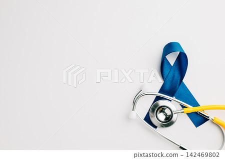 stethoscope and an awareness blue ribbon symbolize the importance of men's health stethoscope and an awareness blue ribbon symbolize the importance of men's health 142469802