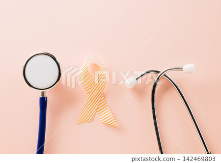 Pink awareness ribbon sign and stethoscope of International World Cancer Day Pink awareness ribbon sign and stethoscope of International World Cancer Day 142469803