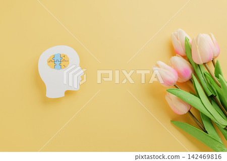 Head paper cut with brain jigsaw and flower on yellow background marks World Down Syndrome Day. Head paper cut with brain jigsaw and flower on yellow background marks World Down Syndrome Day. 142469816