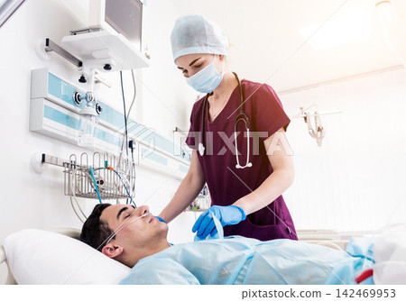 Doctors give resuscitation to a male patient in the emergency room. Cardiac massage Doctors give resuscitation to a male patient in the emergency room. Cardiac massage 142469953