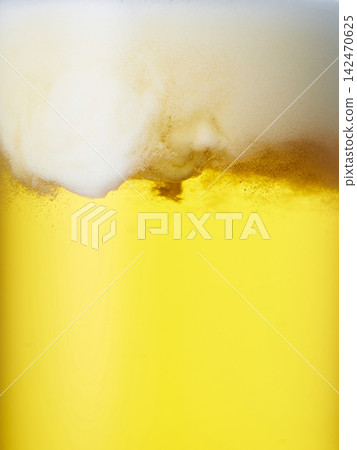 Draft beer poured into a glass, close-up Draft beer poured into a glass, close-up 142470625