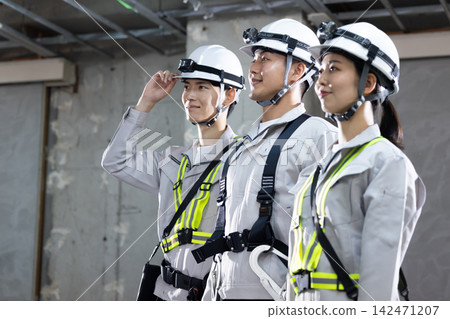 Business: Men and women working at construction sites Business: Men and women working at construction sites 142471207