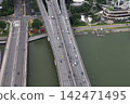 Aerial view of a multi-lane elevated highway bridge over water 142471495