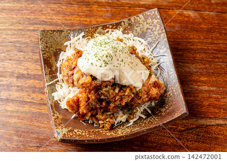 Nanban fried chicken coated in sweet and sour sauce and tartar sauce Nanban fried chicken coated in sweet and sour sauce and tartar sauce 142472001