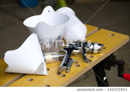 Professional spray gun and accessories for detailed painting and finishing projects Professional spray gun and accessories for detailed painting and finishing projects 142472853
