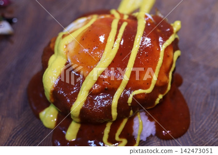 Sauce-Drizzled Dish with Mustard Garnish Sauce-Drizzled Dish with Mustard Garnish 142473051