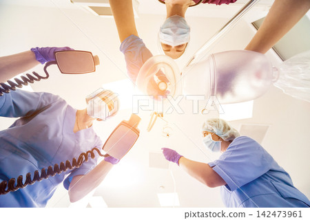 Doctors give resuscitation to a male patient in the emergency room. Cardiac massage Doctors give resuscitation to a male patient in the emergency room. Cardiac massage 142473961