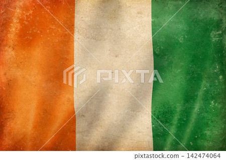 Old vintage flag of Ivory Coast, worn and stained Old vintage flag of Ivory Coast, worn and stained 142474064