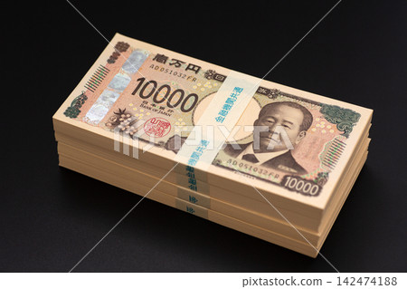 A stack of banknotes worth 4 million yen A stack of banknotes worth 4 million yen 142474188