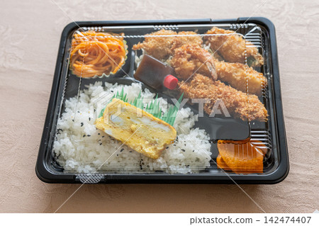 Packaged fried food platter for takeout Packaged fried food platter for takeout 142474407