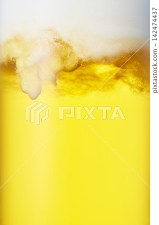 Close-up of draft beer poured into a mug. Close-up of draft beer poured into a mug. 142474437
