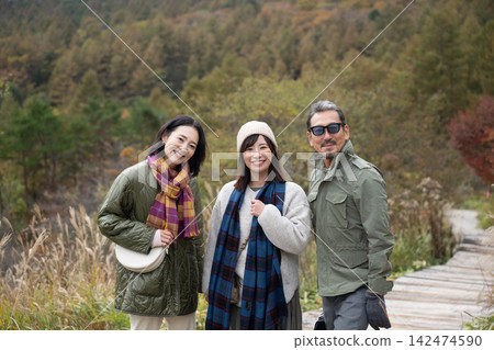 Three people enjoying the view of Kiyosato Plateau Three people enjoying the view of Kiyosato Plateau 142474590